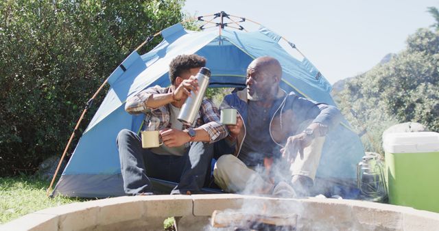 Father and Son Camping Near Tent with Thermos and Mug - Download Free Stock Images Pikwizard.com