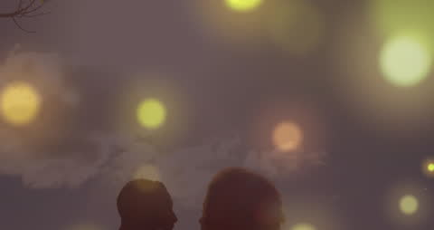 Abstract Night Scene with Glowing Lights and Silhouetted Figures