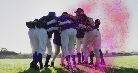 Female baseball team huddling with vibrant energy