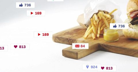 Beef Burger With Fries and Mustard on Cutting Board with Social Icons
