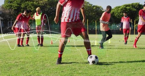 Soccer player practicing dribbling skills on sunny day