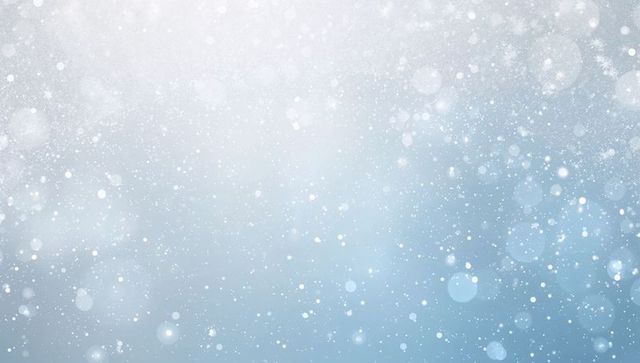 Soft blue winter bokeh with falling snow specks and sparkling light for holiday design