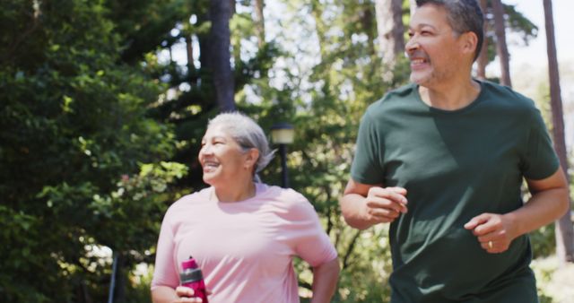 Senior Couple Enjoying Morning Jog in Park - Download Free Stock Images Pikwizard.com