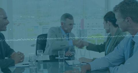 Executives shaking hands over agreement with data waveform overlay in glass boardroom