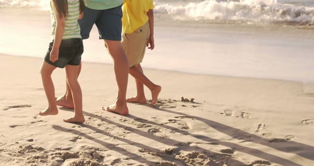 Family walking on beach at sunset enjoying summer - Download Free Stock Images Pikwizard.com