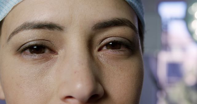 Eyes of caucasian female surgeon standing in operating theatre. Work, medical services, healthcare and hospital, unaltered.