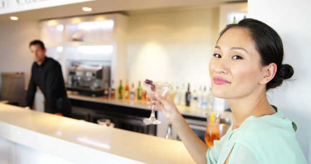 Elegant Woman Enjoying Cocktail at Modern Bar Counter - Download Free Stock Images Pikwizard.com
