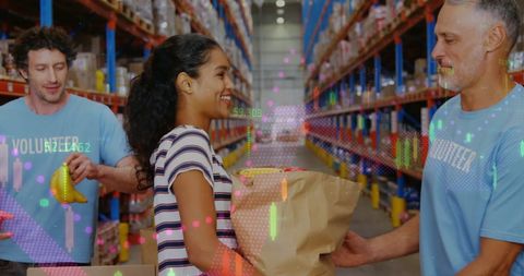 Diverse Volunteers Packing Goods in Warehouse with Digital Overlay - Download Free Stock Images Pikwizard.com