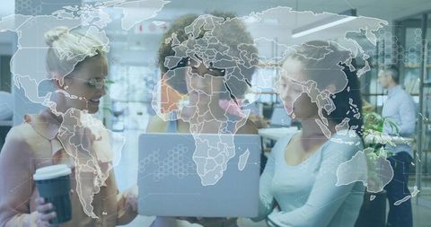 Multinational team collaborating over laptop with digital world map overlay