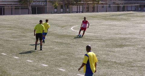 Passionate Soccer Players Competing on Field during Match