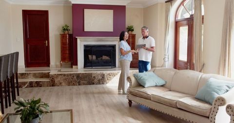 Senior Couple Planning in Spacious Luxury Living Room