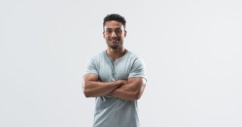 Confident Young Man in Casual Attire with Arms Crossed - Download Free Stock Images Pikwizard.com