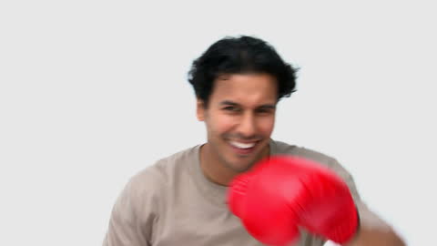 Energetic Boxer in Red Gloves Throwing Punch