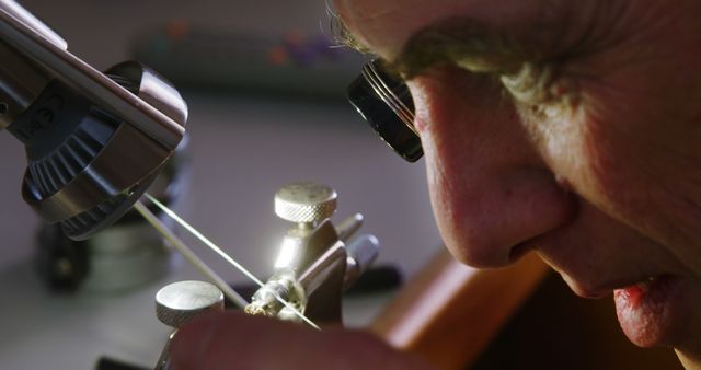 Close-Up of Horologist Inspecting Timepiece Mechanism - Download Free Stock Images Pikwizard.com