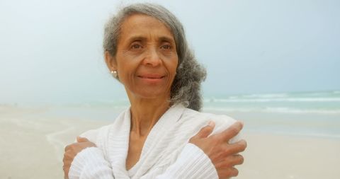 Senior Woman Embracing Tranquility on Beach
