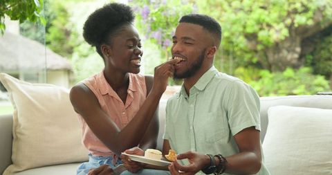 Happy Couple Enjoying Sweet Treats on Outdoor Patio