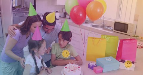 Happy Biracial Family Celebrating Birthday with Cake and Gifts
