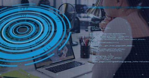 Mature man coding on laptop with blue HUD overlay, workspace technology, data visualization