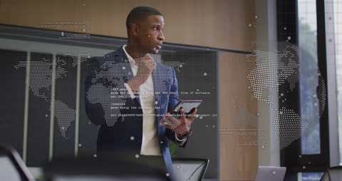 Businessman Analyzing Digital Data with Tablet in Modern Office