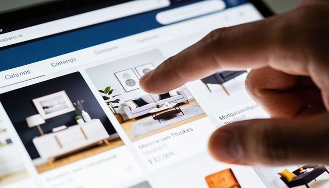 Selecting modern living room furniture on tablet ecommerce catalog, finger tapping thumbnails