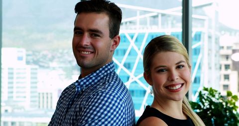 Confident Business Colleagues Smiling in Modern Office