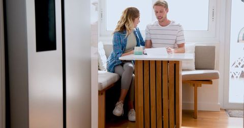 Happy Couple Relaxing with Morning Coffee at Home
