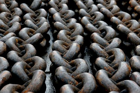 Close-up of rusty iron chains with intricate texture