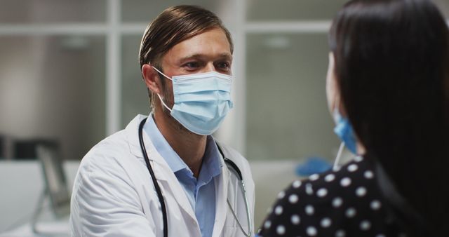 Caucasian male doctor wearing face mask and gloves taking swab test from patient - Download Free Stock Photos Pikwizard.com