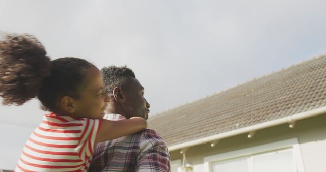 Happy Father Piggybacking Daughter Outdoors in Bright Sunlight - Download Free Stock Images Pikwizard.com