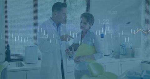 Doctor and Patient Analyzing Medical Data in Consultation Room