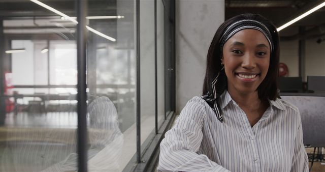 Smiling Professional Woman in Modern Office Environment - Download Free Stock Images Pikwizard.com