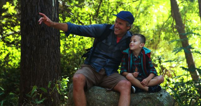 Father and Son Exploring Nature in Sunlit Forest - Download Free Stock Images Pikwizard.com