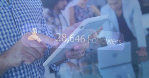 Man presenting digital follower growth statistics on tablet