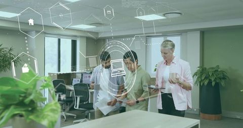 Business Team Analyzing Digital and Printed Reports in Modern Office