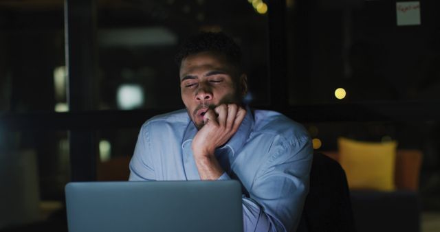 Tired Businessman Yawning While Working Late at Night in Office - Download Free Stock Images Pikwizard.com