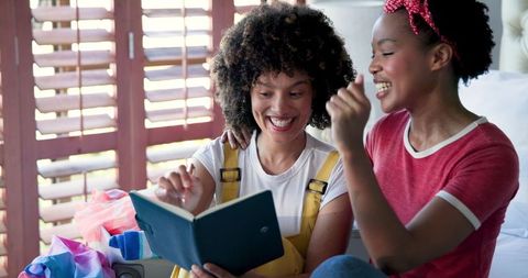 Joyful Female Friendship Experiencing Shared Moments at Home