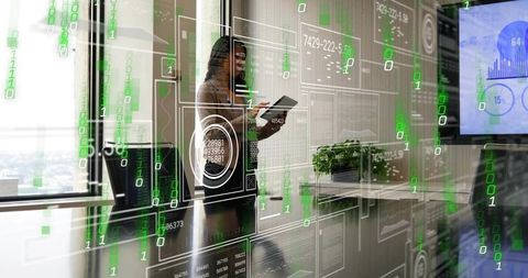 Chinese executive presenting digital data on tablet with futuristic hud in glass boardroom