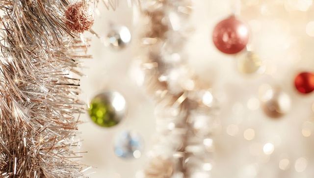 Sparkling Rose Gold Tinsel Garland with Soft Bokeh Ornaments and Festive Glow