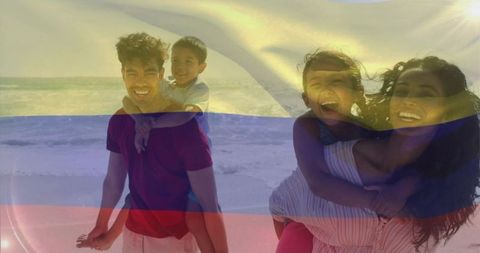 Happy family carrying children on sunny beach with tricolor flag overlay
