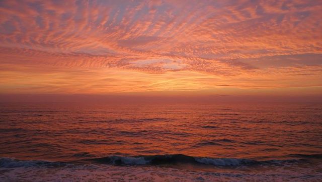 Golden-Hour Ocean Horizon with Altocumulus Cloudscape and Foamy Surf