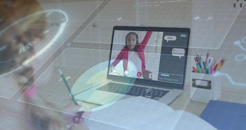 Virtual classroom laptop showing student raising hand during remote learning at home desk