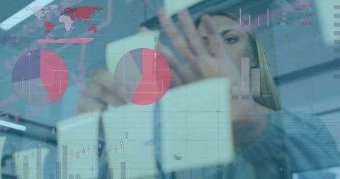 Businesswoman Analyzing Data Charts for Strategic Planning