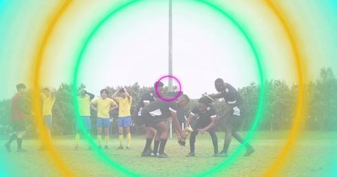 Rugby players forming scrum teamwork on grass pitch with vibrant concentric rings overlay