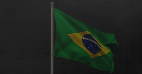 Brazilian National Flag Waving against Dark Background