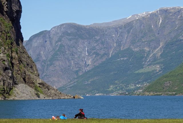 Couple Relaxing by Mountain Lake on Sunny Day - Download Free Stock Images Pikwizard.com