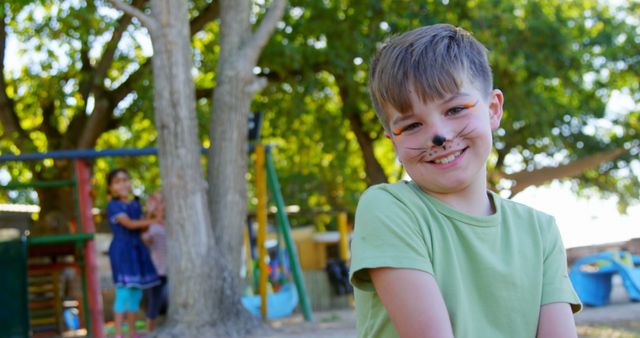 Happy Child with Face Paint Enjoying Outdoor Park - Download Free Stock Images Pikwizard.com