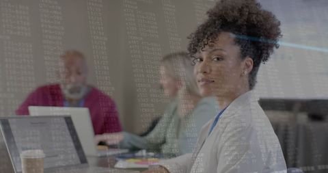 Diverse Professionals in Modern Office with Digital Data Overlay