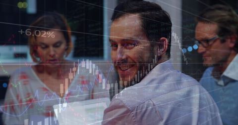 Business Team Analyzing Financial Data in Dynamic Office