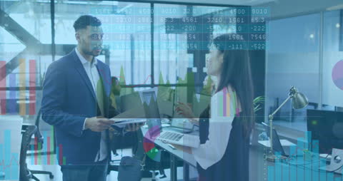 Multiracial Team Analyzing Data Projections in Modern Office