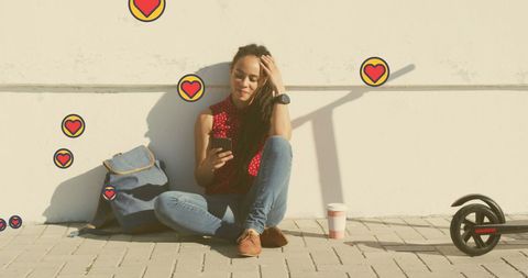 Smiling woman checking phone with social media notifications